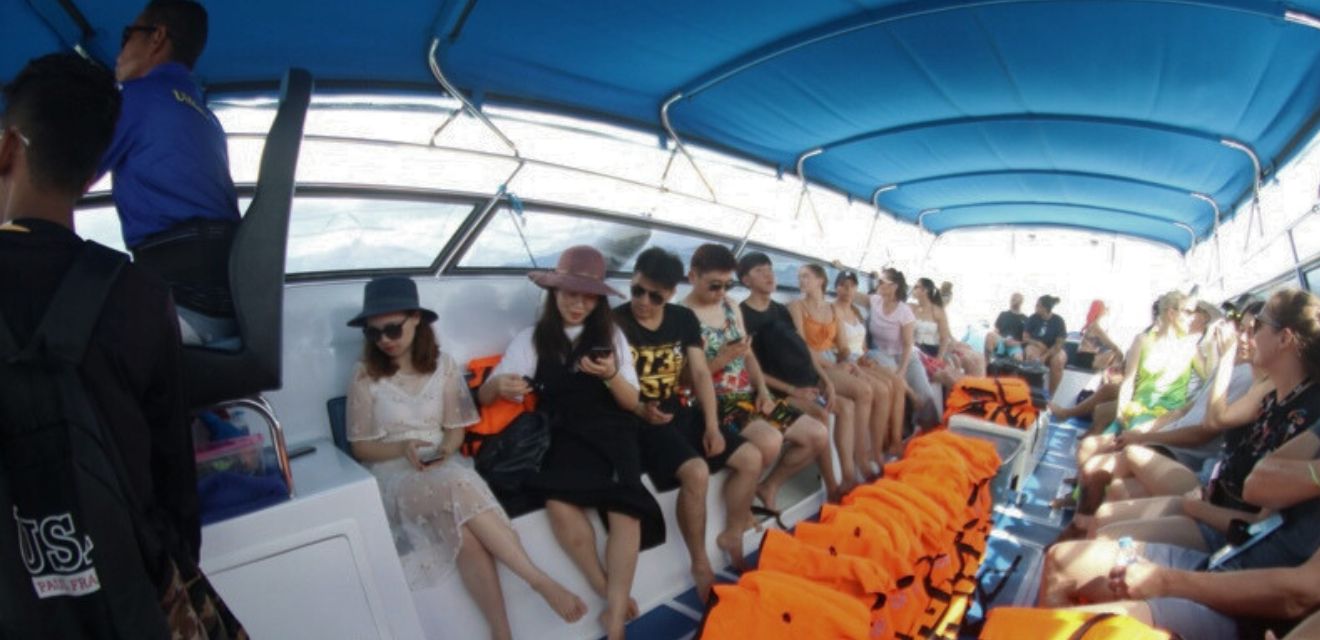 group of travelers on tour to koh phi phi isalnds from phukt speedboat