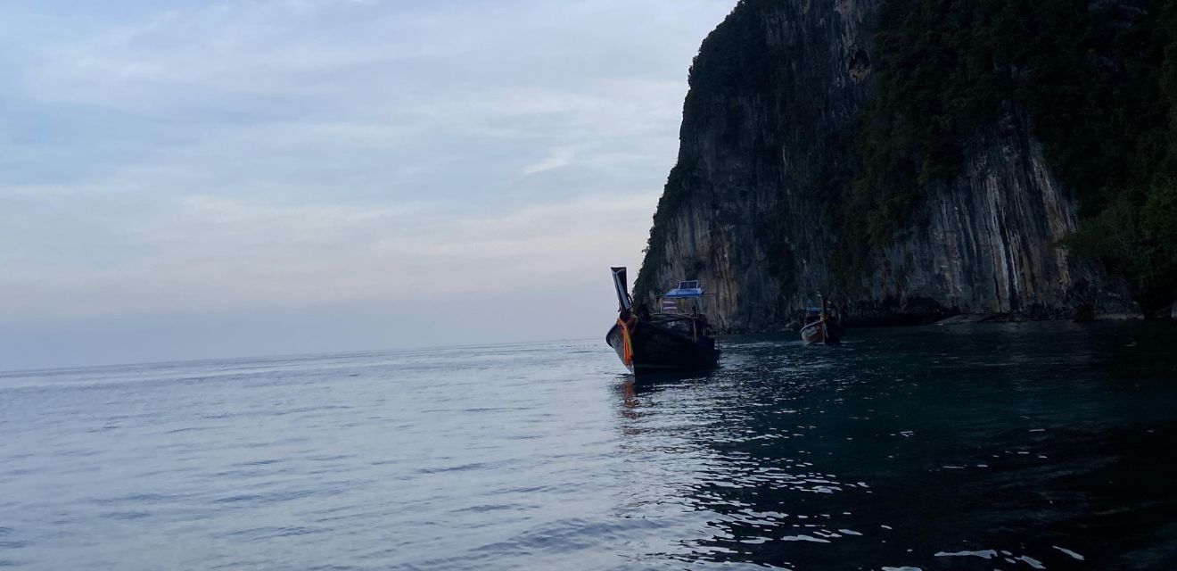 longtail boat phi phi island sunset time