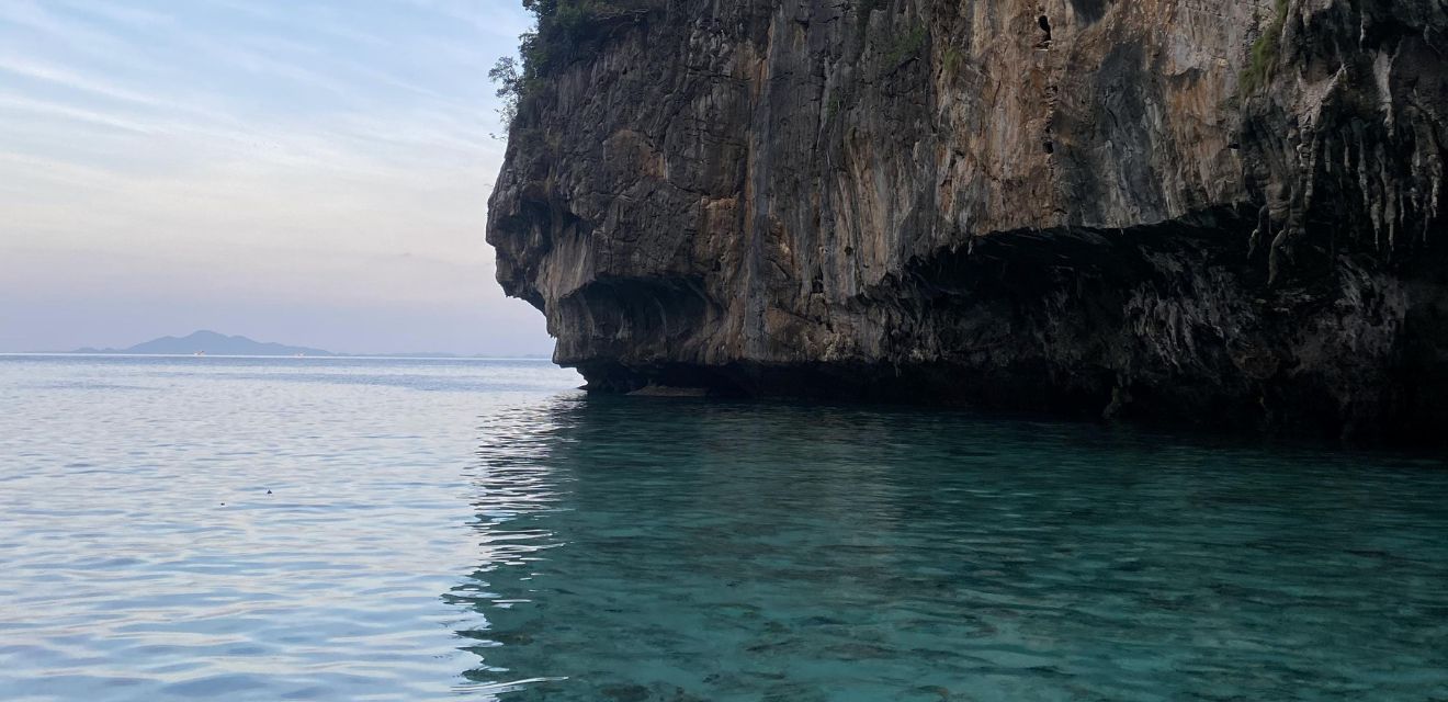 pileh bay sunset time longtail boat