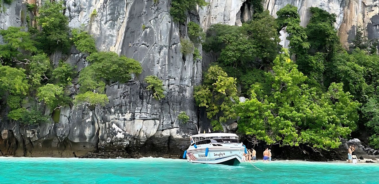 speedboat in monkey beach phi phi islands on one day tour from phuket