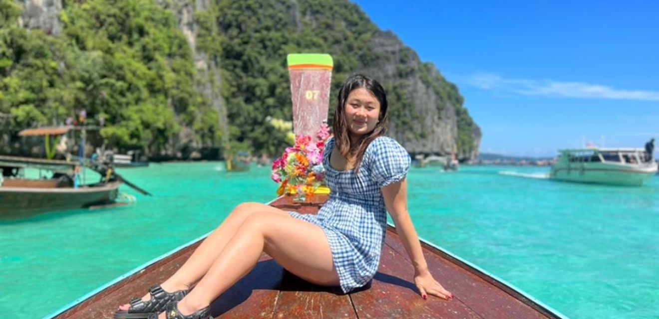 private longtail boat at phi phi isand with clear water