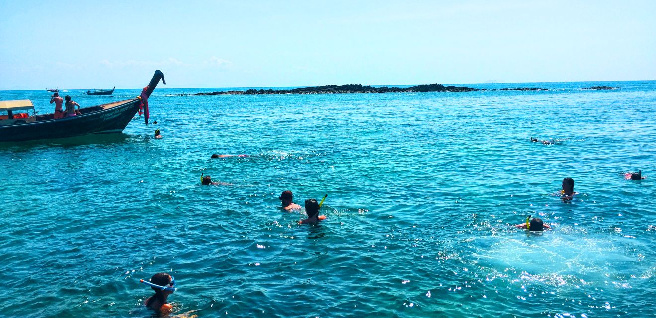 snorkeling koh phi phi blue water longtail boat blacktip reef shark snorkel point long beach tour