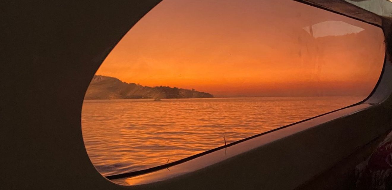 sunrise from speedboat window early bird maya bay tour