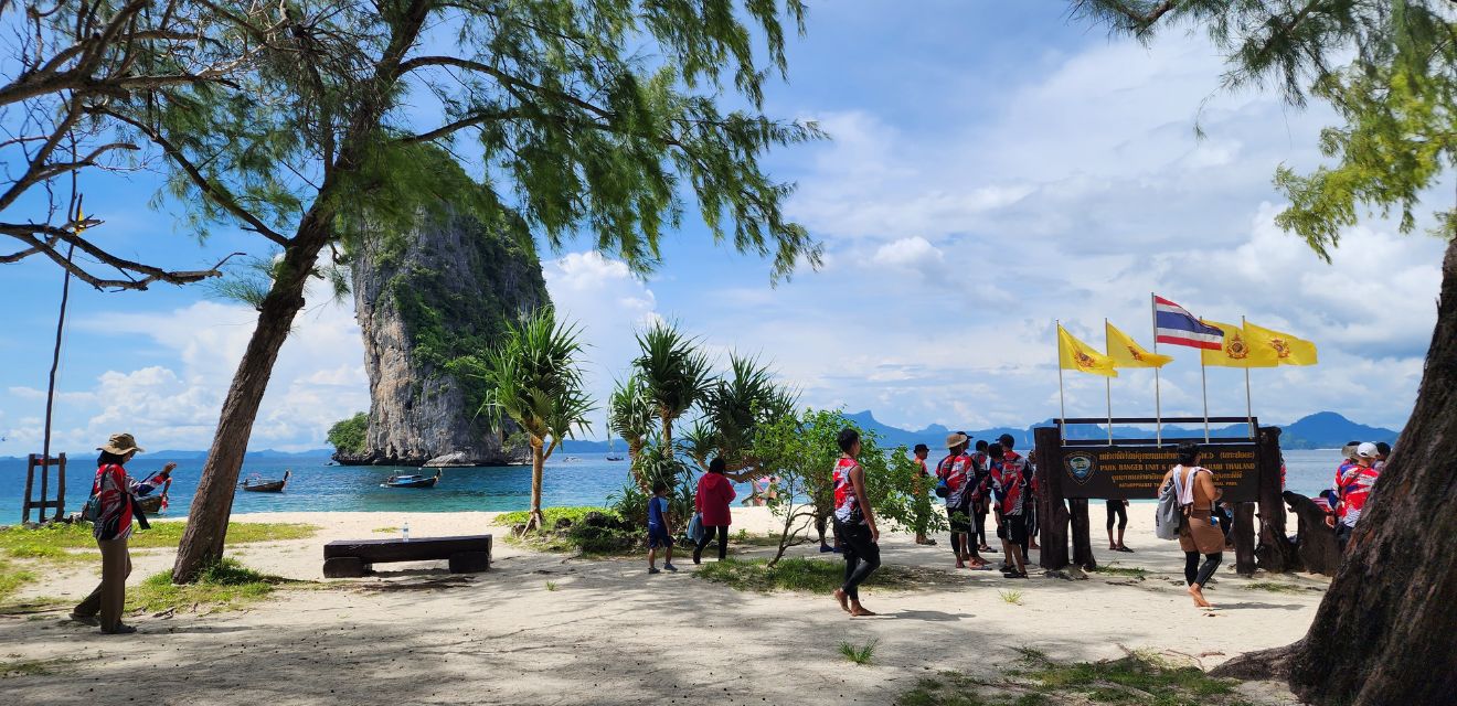 koh poda island resturant and national park official sign with large tour group from malaysian