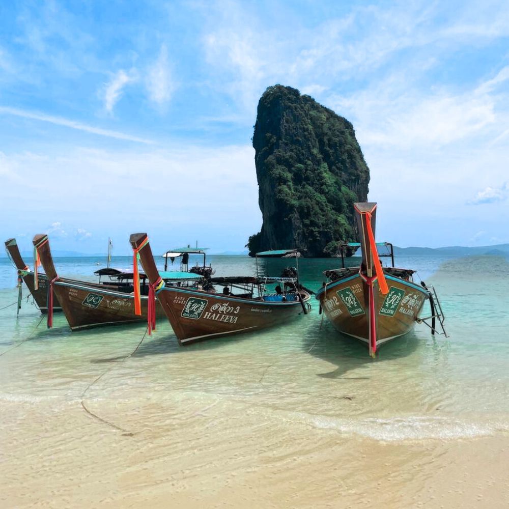 krabi four 4 island koh poda with longtail boats on beach