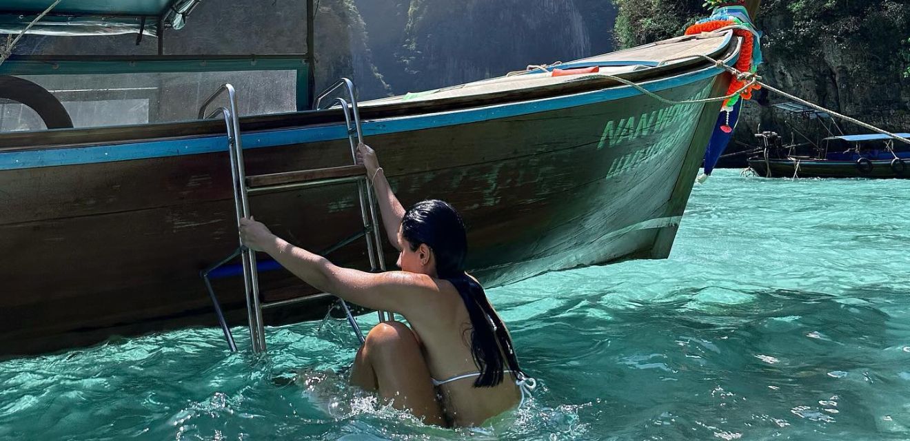 phi phi island pilleh lagoon tour girl climb longtail boat with ladder