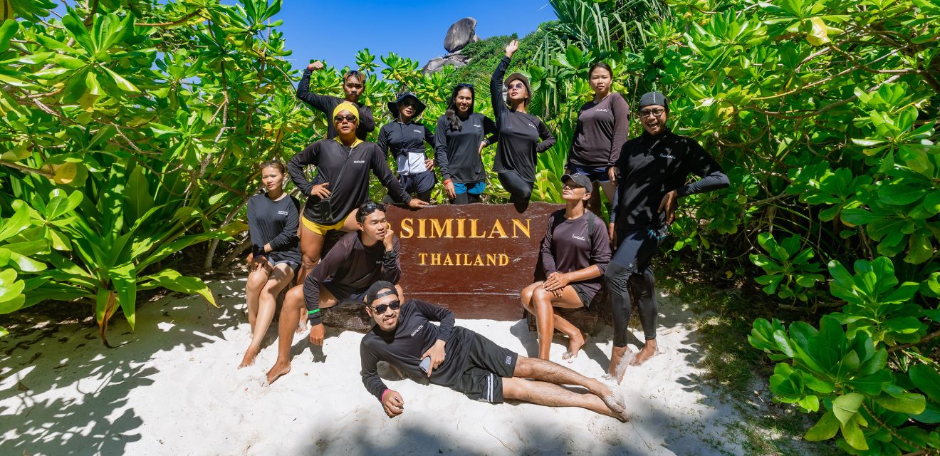 similan island national park sign group photo tourists