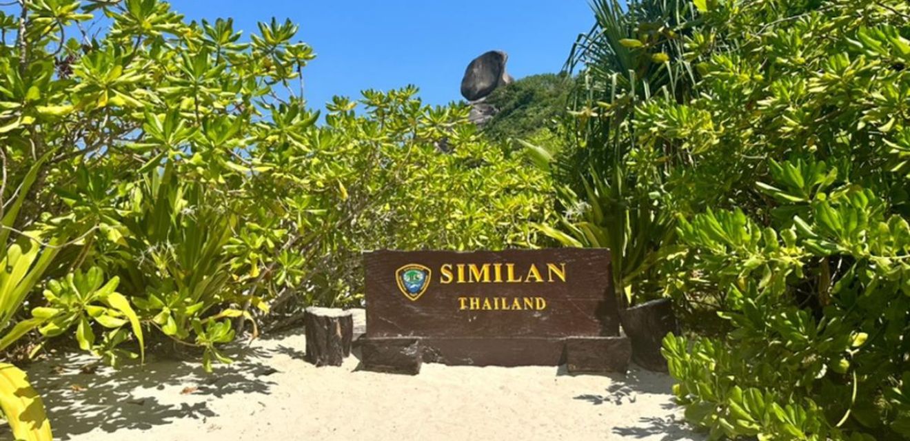 siminal islands national park sign and sail rock background