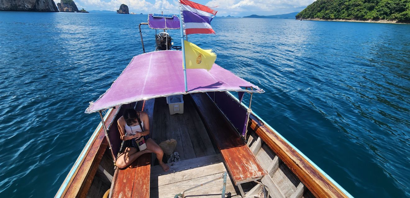 thai longtail boat tour krabi four island blue sea swim snorkel sun