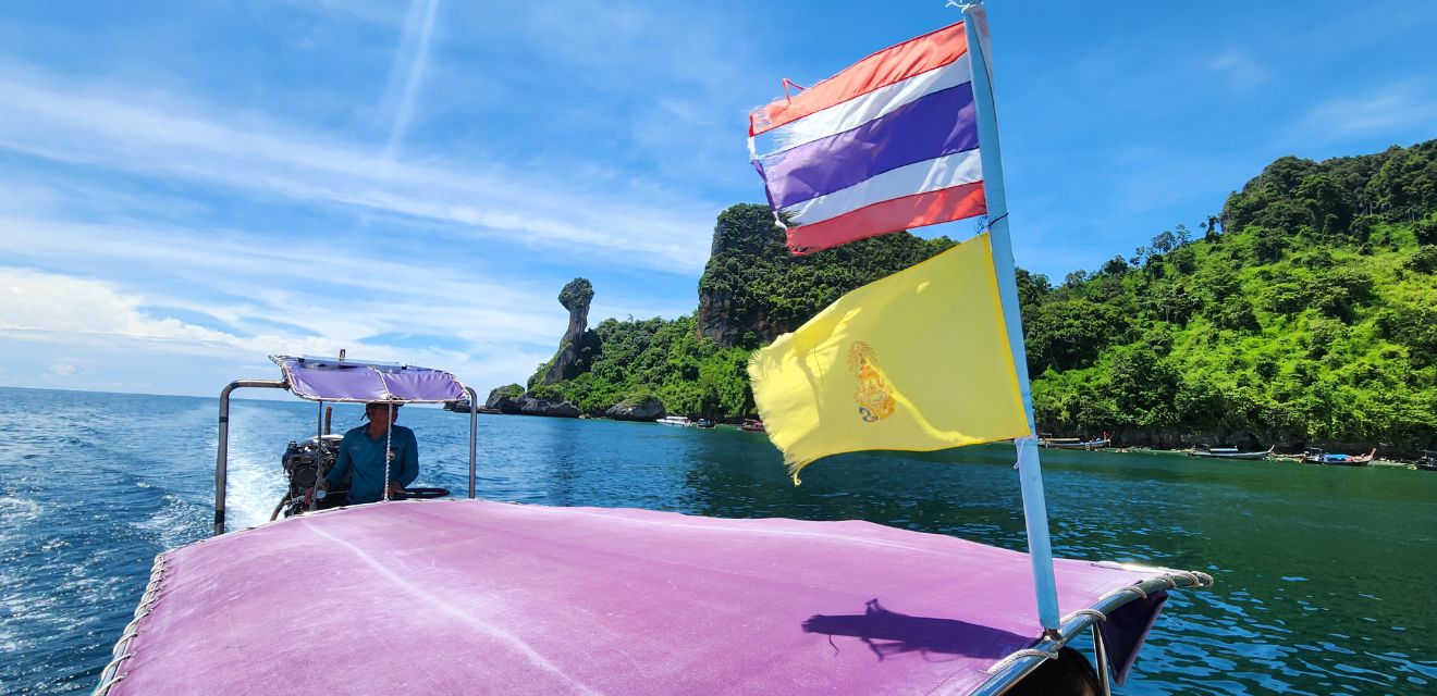 thailand flag on thai longtail boat krabi four island tour koh gai chicken island